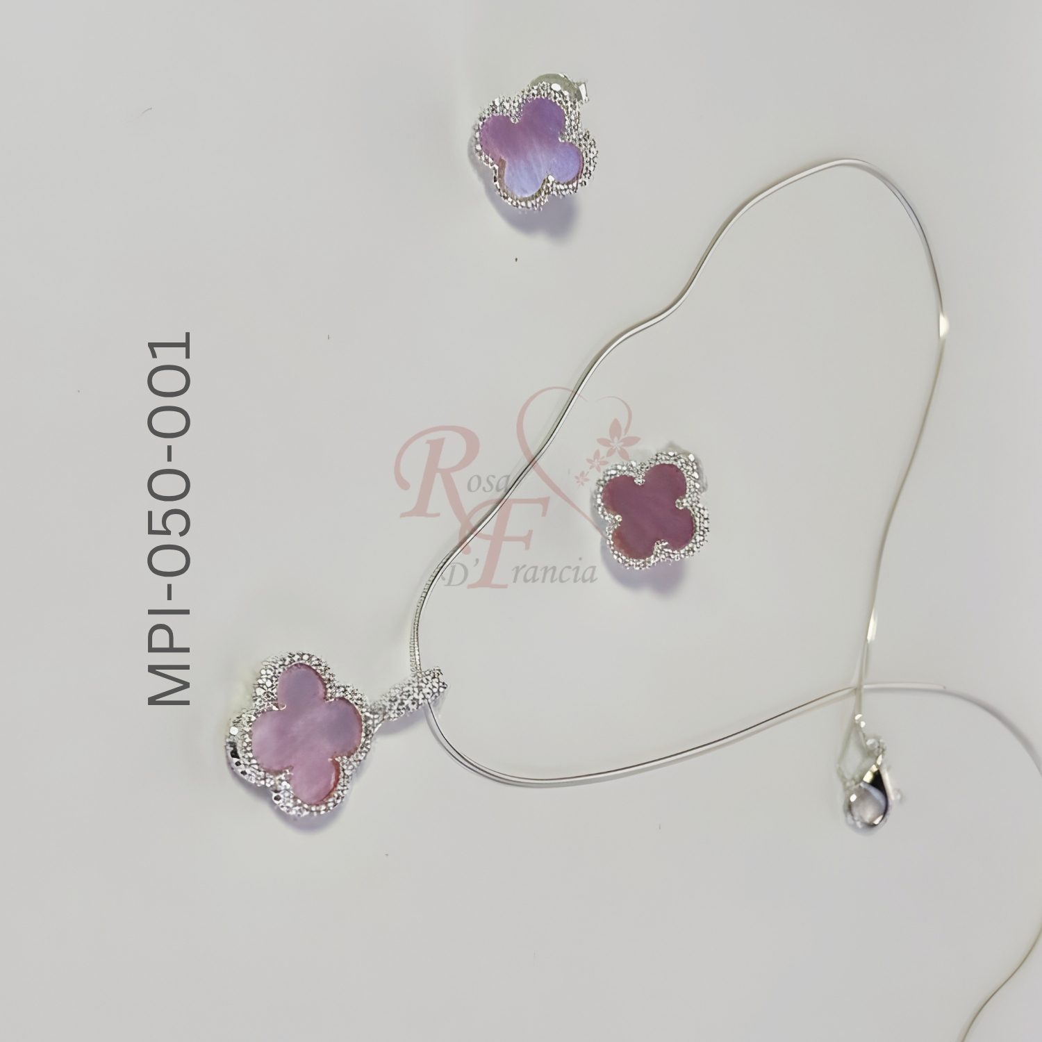 Juego de aretes con dije